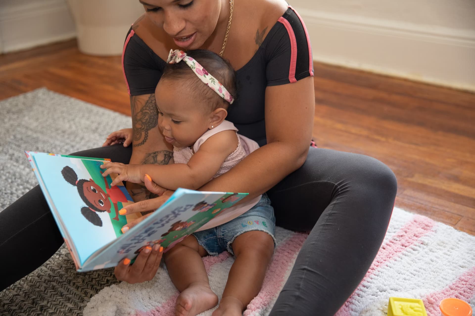Mom and baby looking through at a photo book