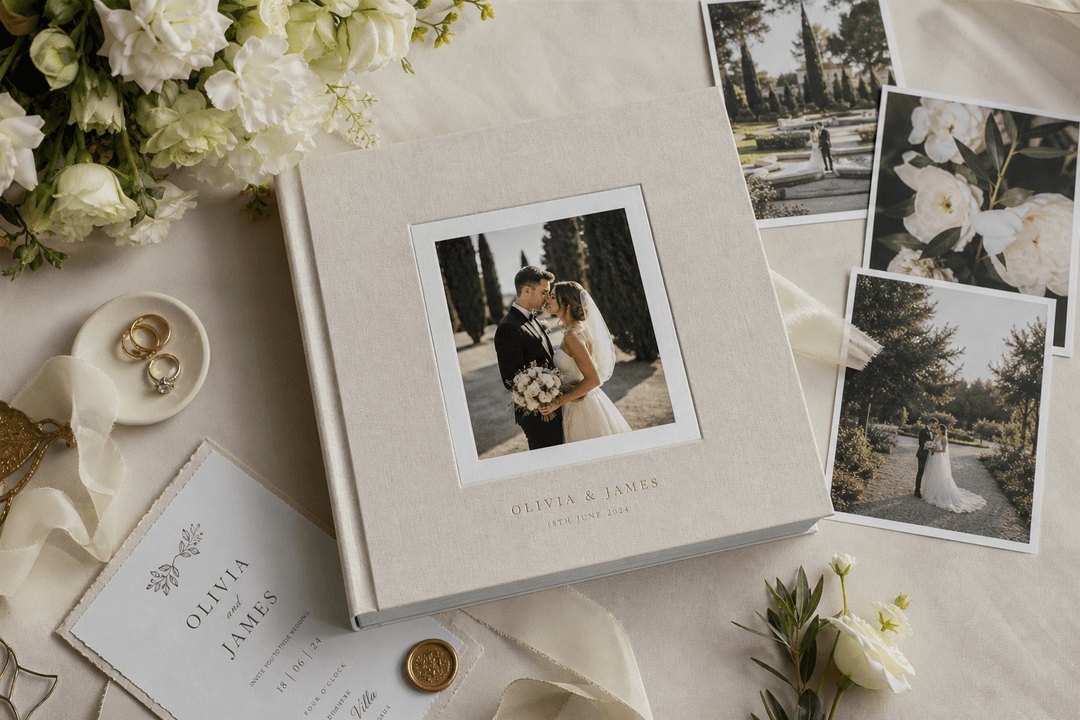 Elegant wedding photo album on a table with flowers and keepsakes