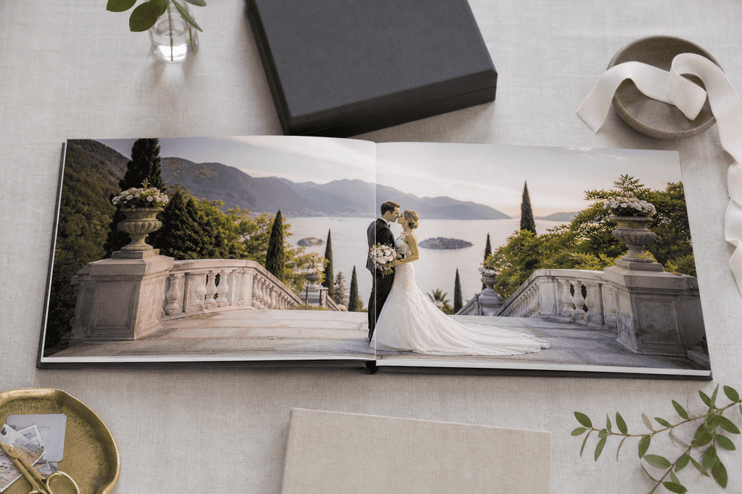 Elegant custom wedding photo book open on a table