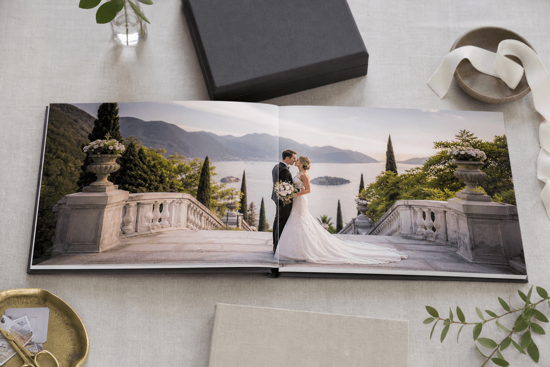 Elegant custom wedding photo book open on a table