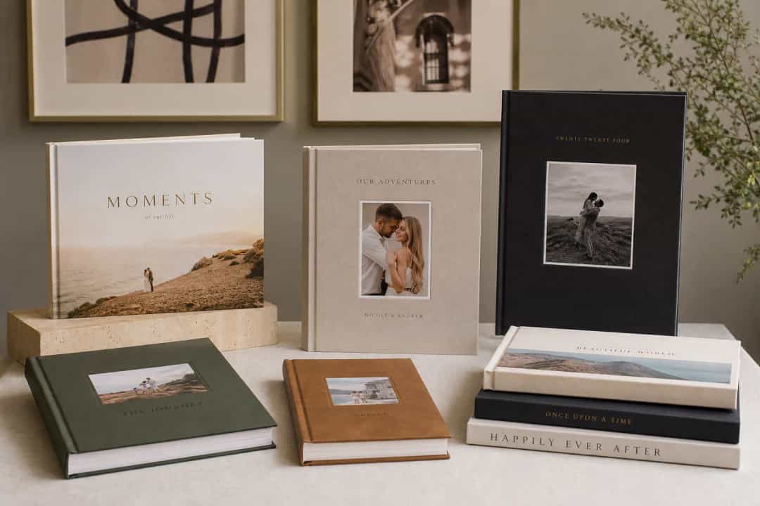 Premium printed photo books in different sizes and cover styles on a table