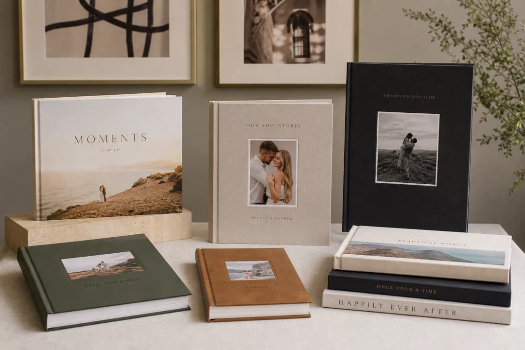 Premium printed photo books in different sizes and cover styles on a table