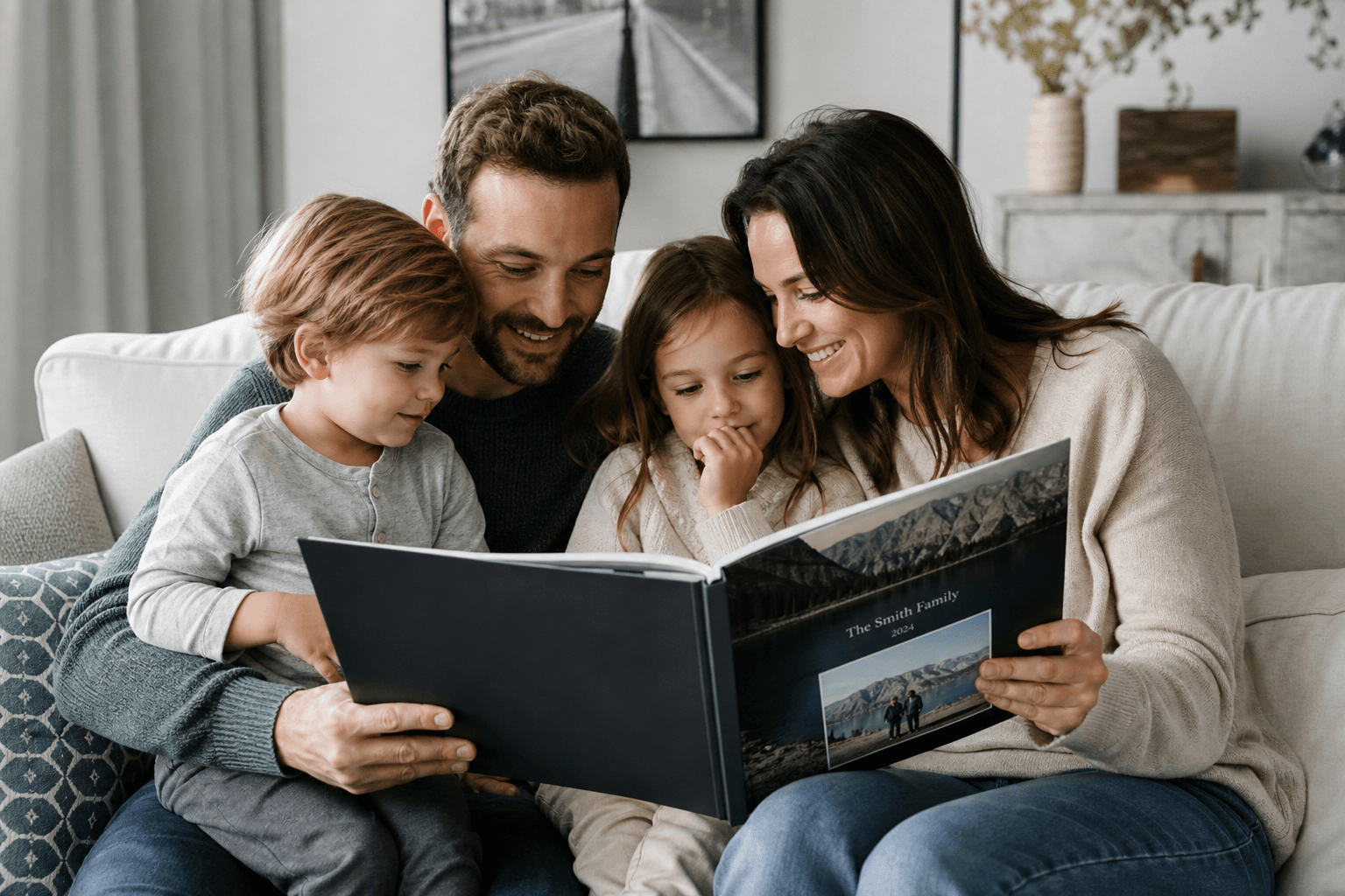 Family looking through a personalized photo book together on a sofa